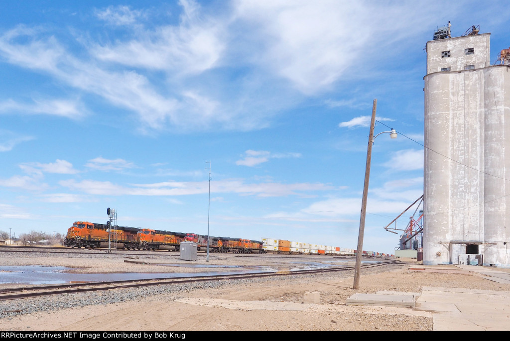 BNSF 7120 leads westbound stacks past the grain elevator at White Deer, TX